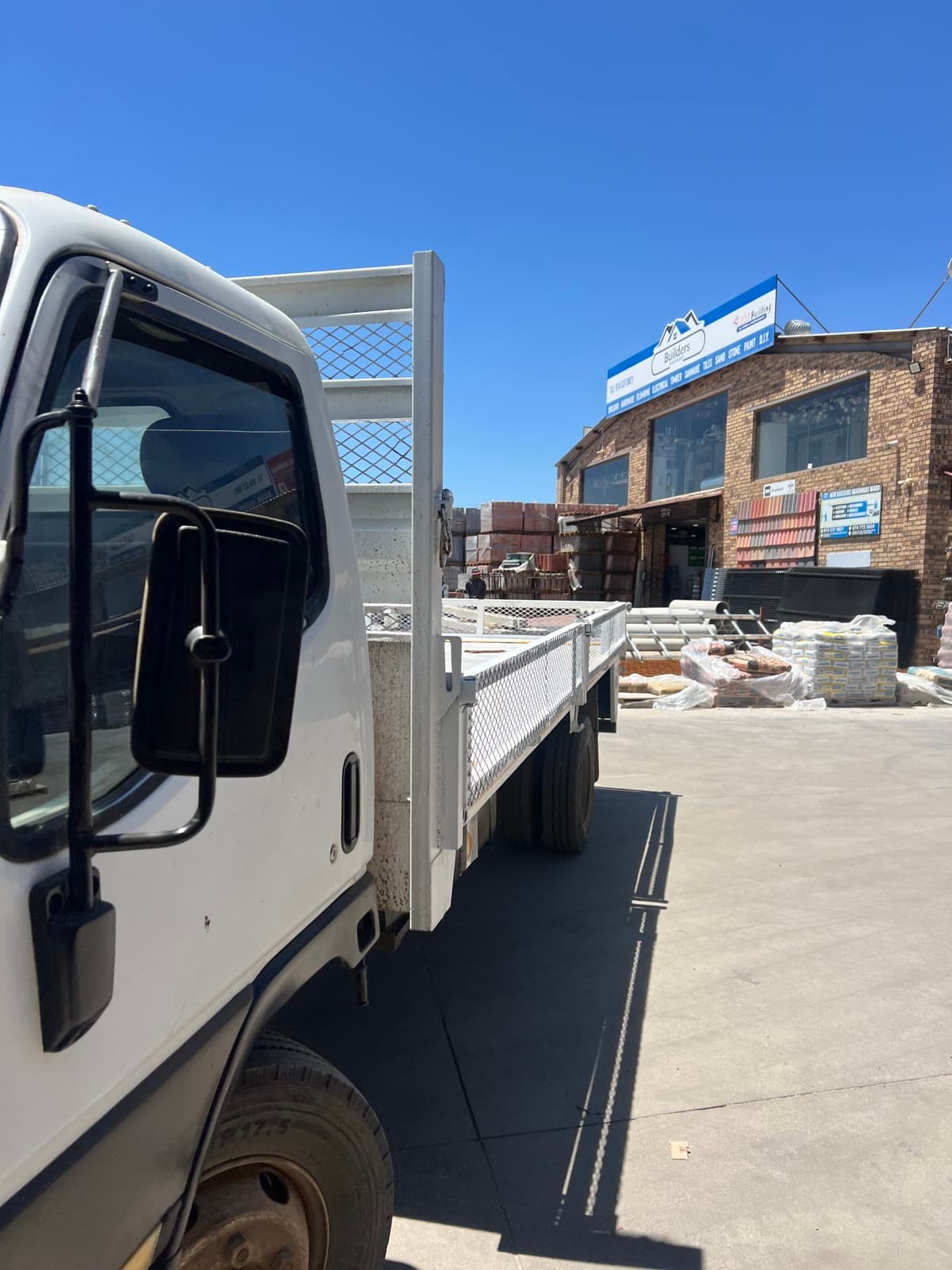Mahapa Logistics open truck parked in a hardware yard for a collection